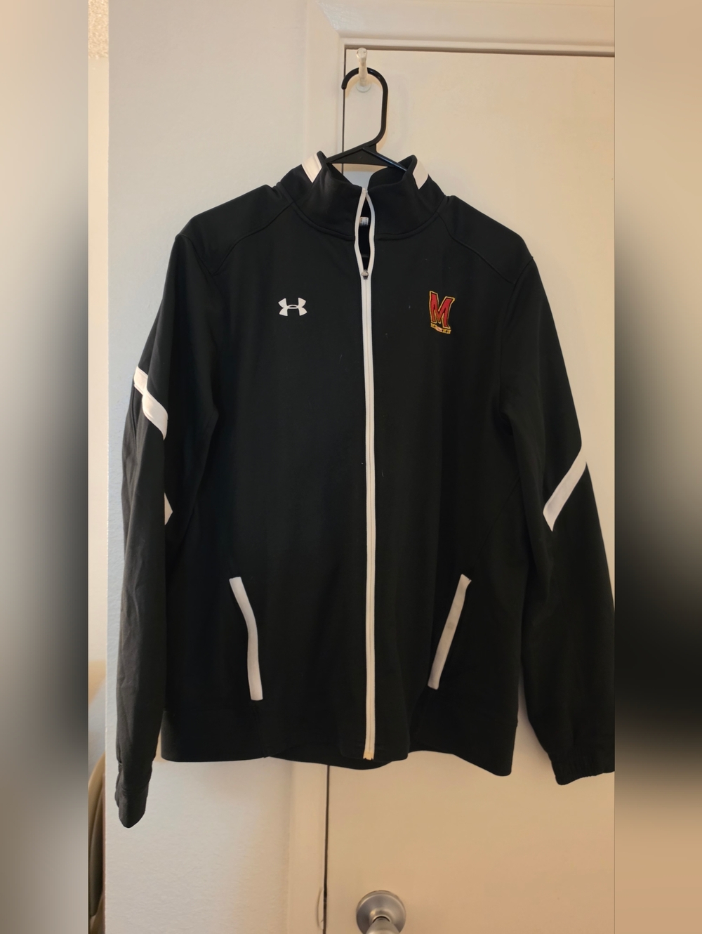 Under Armour Black Jacket with White Trim and Red/Gold Patch